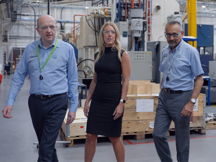 David Stanley, Rebecca Shellard and Manesh Pandya of ELE taking a tour of a factory - wearing eye protection.
