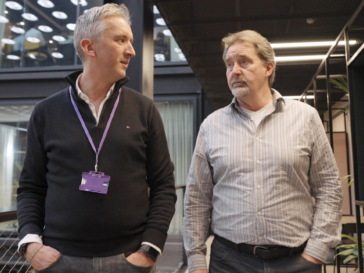 LDC backed Kerv founders Alastair Mills and Mike Ing walking through an office floor.