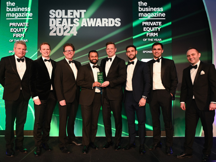 LDC colleagues on stage accepting an award at the Solent Deals Awards 2024.